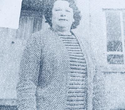 grainy b&w photo of woman 