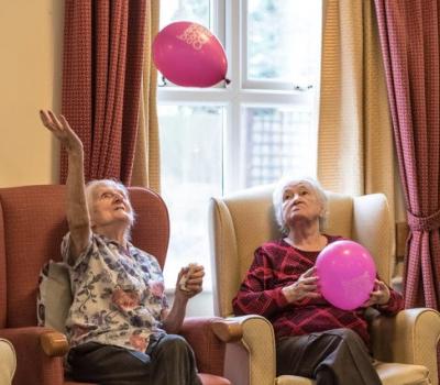 Seated women with balloons